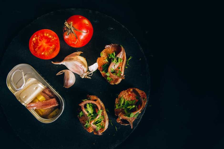 Foto de Anchoas en Escabeche con Pan Tostado y Tomate