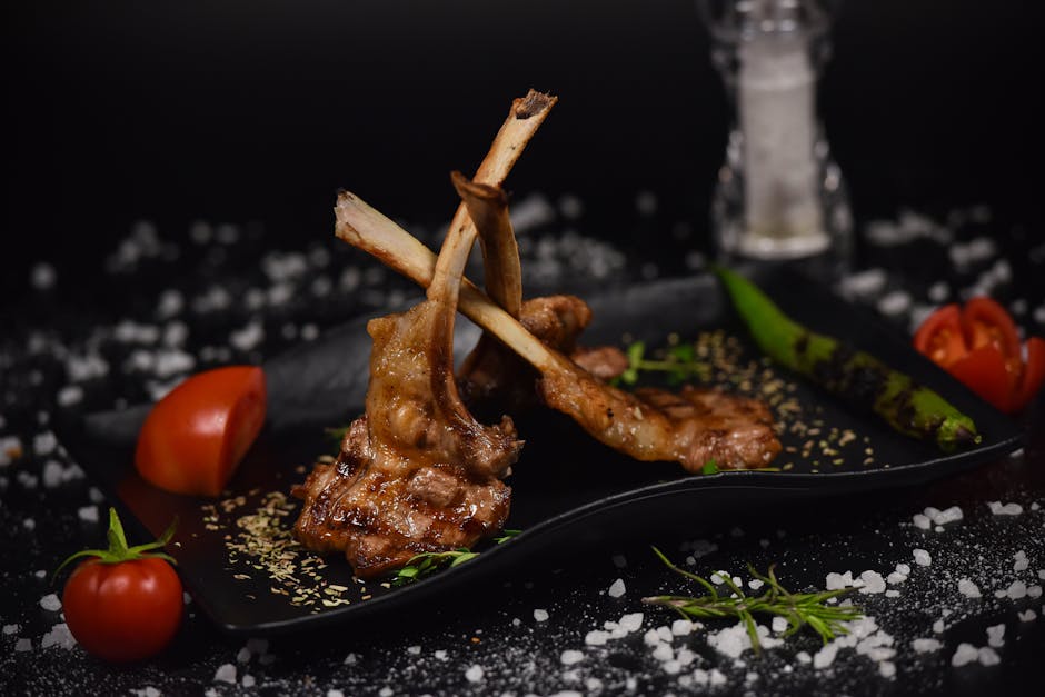 Foto de Chuletillas de cordero con patatas rejilla y pimientos