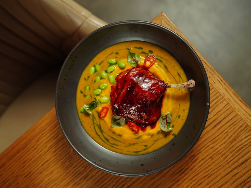 Foto de Confit de pato con puré de manzana y calabacín